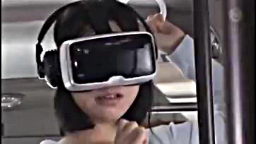 Asian woman caught in bus with VR glasses